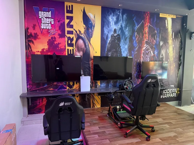 Gaming stations and a steering setup inside Legends Arena